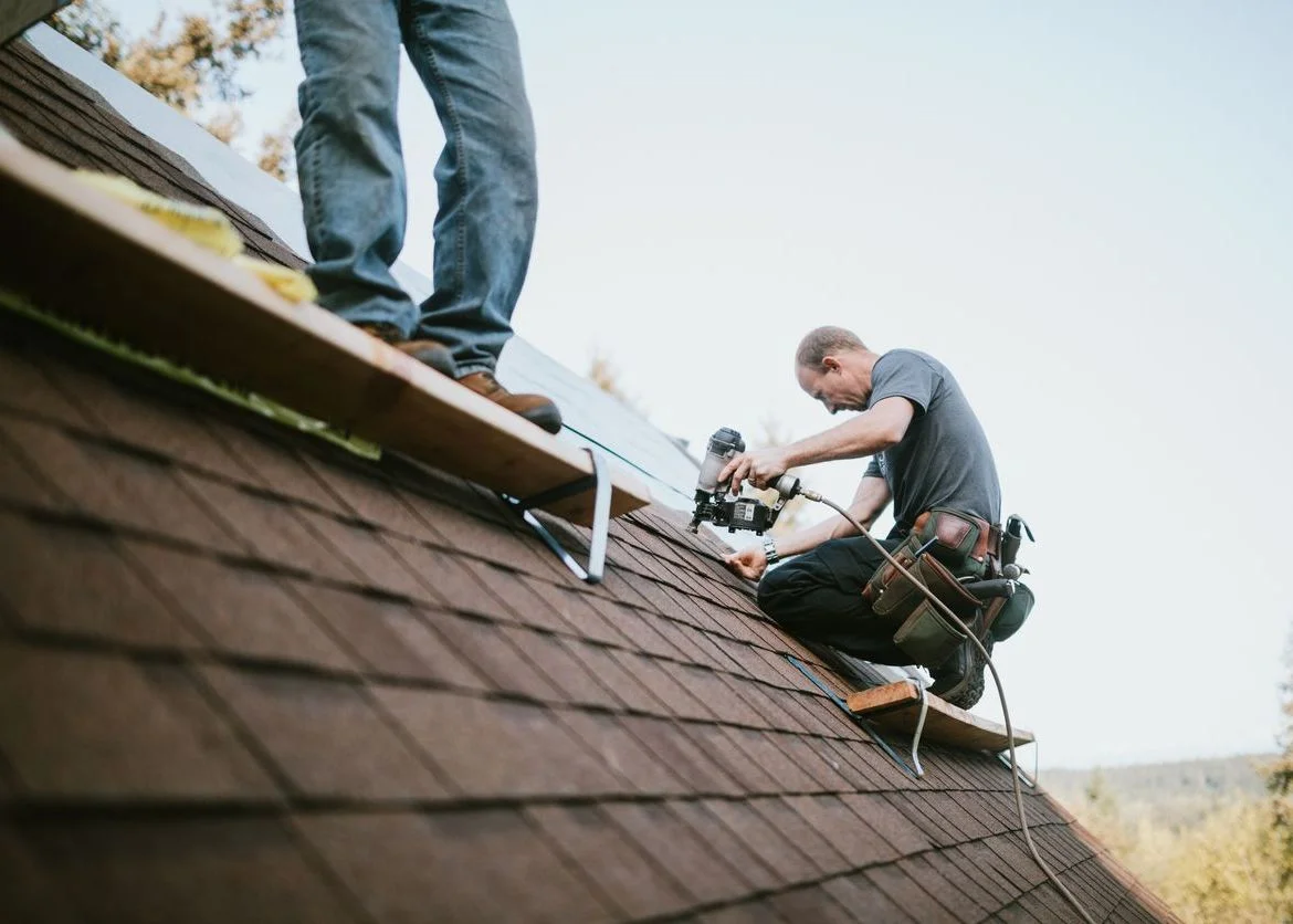 roofing contractor installing new shingles on a home in fauquier county virginia